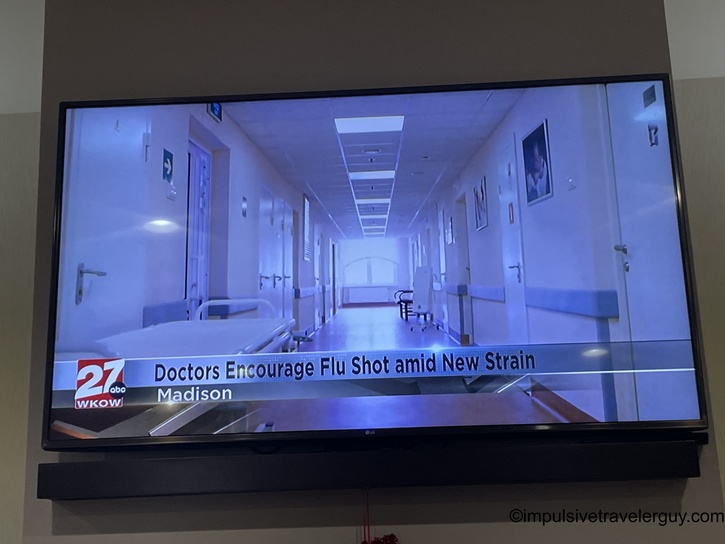 Hotel room TV displaying local news chyron 