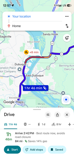 Google Maps screenshot showing the return route from near Dubuque, Iowa to home — 84 miles, 1 hour and 46 minutes, routing south along the Mississippi through hilly terrain with a road closure detour adding 8 minutes.