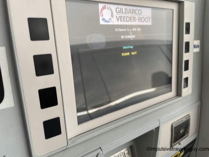 Close-up of a frozen gas pump screen displaying the message 'Starting PLEASE WAIT'.