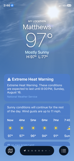 Smartphone weather app screenshot showing a hot temperature of 97 degrees in Matthews with an active Extreme Heat Warning.